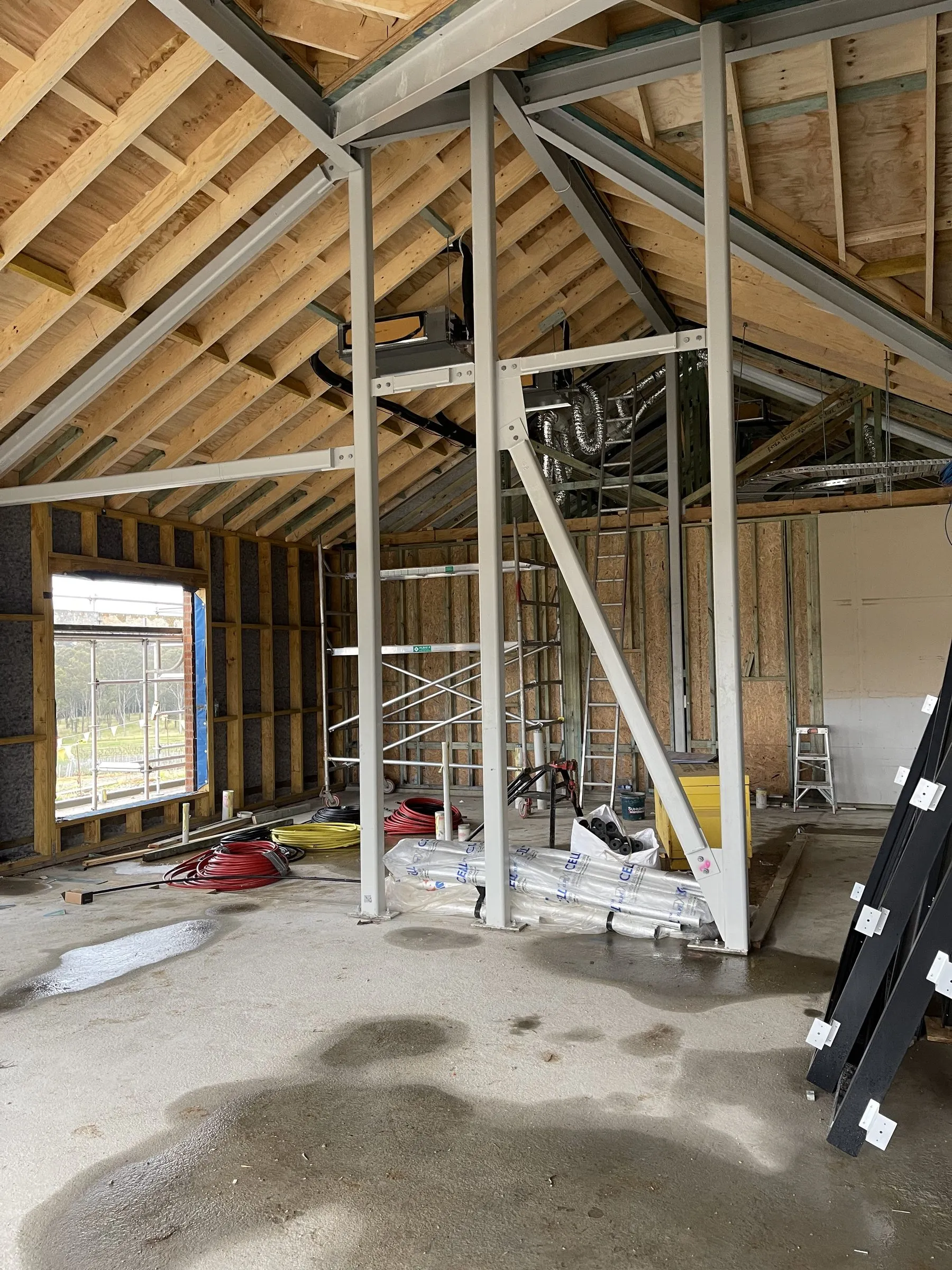 Cathedral roof framing with structural steel portal frame